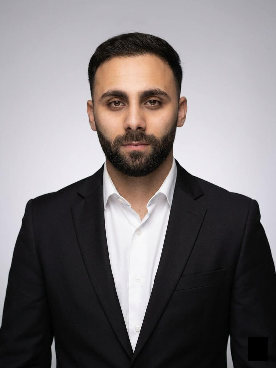Professional headshot of Taha Islam